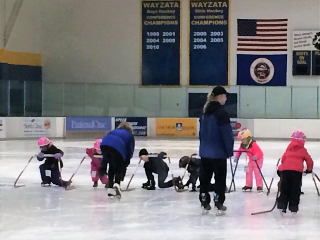 Beginner Skate School class learning to stand on ice